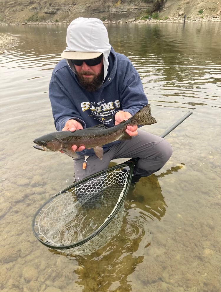 https://www.bowriverflyfishing.ca/wp-content/uploads/2021/12/bow-river-fly-fishing-landed-trout.jpg