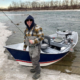 Scott fly fishing guide with drift boat on the bow river near Calgary.